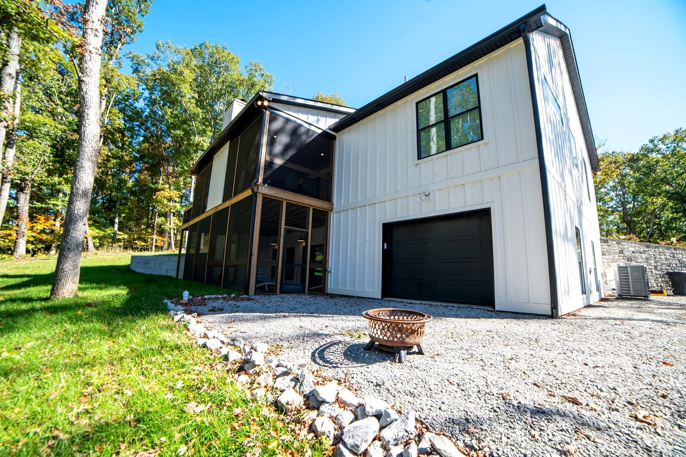 Backyard firepit — Stone-circled firepit just off the back of the house