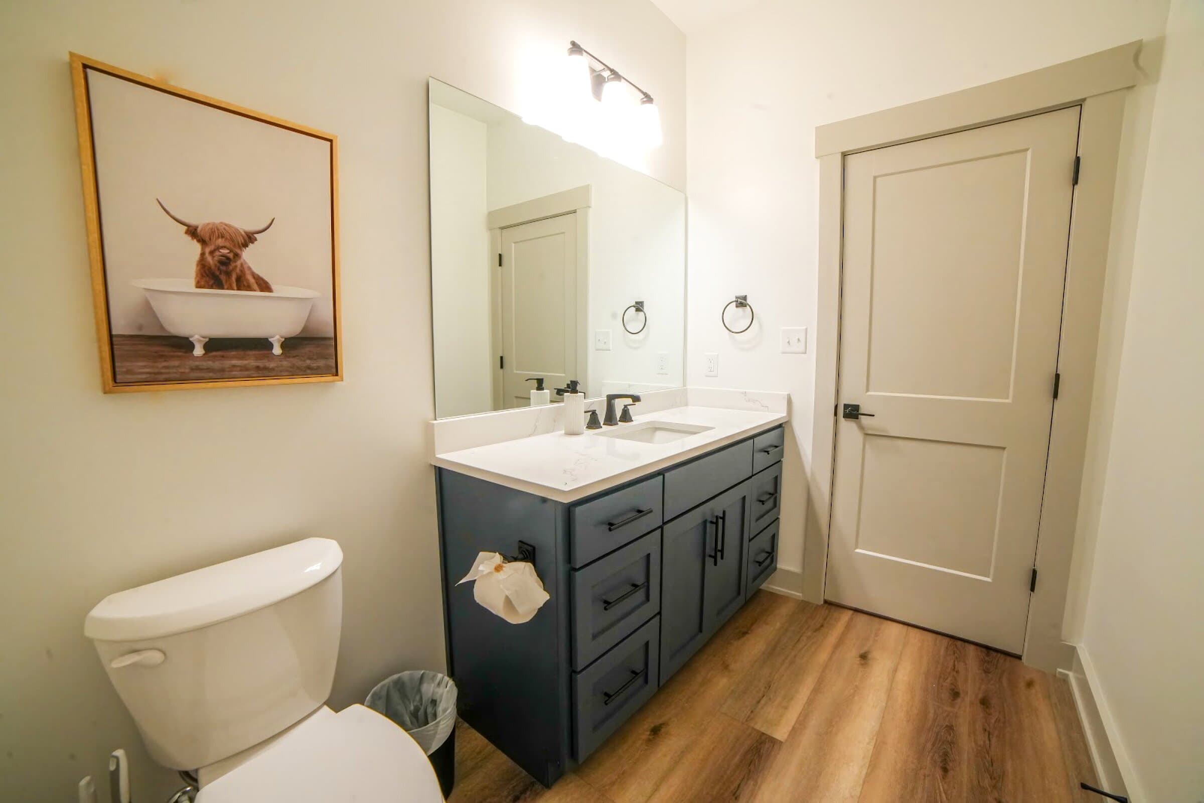 Basement bath (shared) — Tub-shower combo, vanity; shared by both basement bedrooms