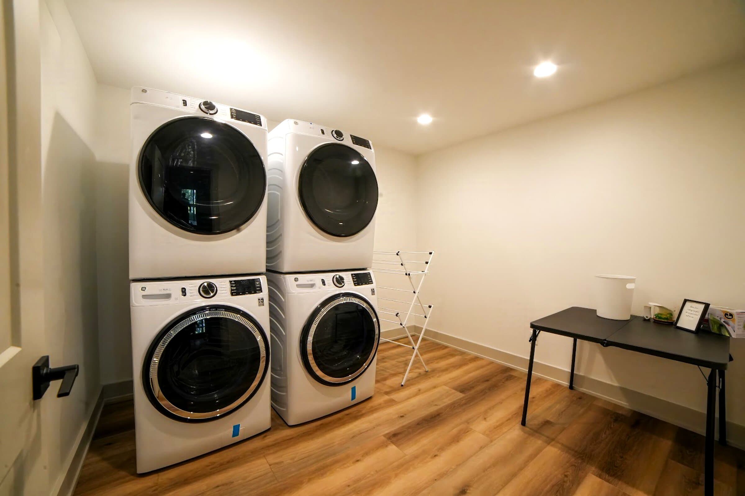 Two laundry sets — Two stacked washer-and-dryer pairs — for big groups